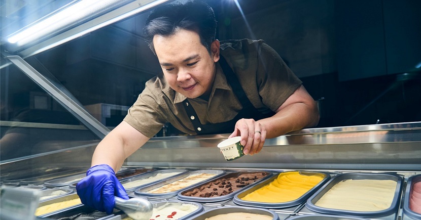 Owner of Denzy Damien Yau scooping a serving of Chrysanthemum Goji, part of its popular no-sugar-added range.