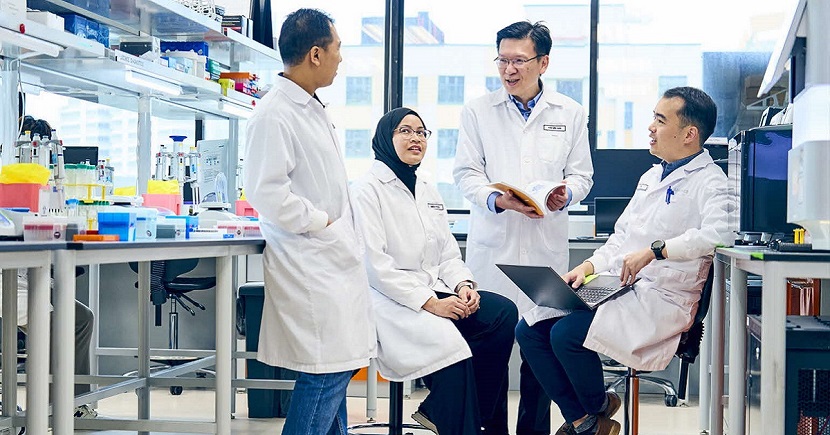 Dr Tan (second from right) with medical technologists at Lucence’s Singapore lab