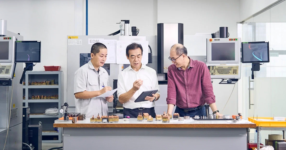 Mr Chee (centre, pictured with engineer Jian Qing, left, and engineering director Lim Ching Teck, right) decided to focus on manufacturing precision lens components for automotive lighting, catering to various tech and engineering companies. PHOTO: SPH MEDIA