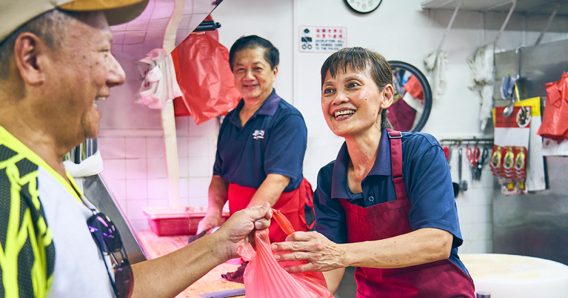 Second-generation owners Madam Oh Siew Guat (right) and her husband Mr Neo Ah Leong manage Quan Shui Wet Market’s eight traditional stalls, including their Bukit Batok outlet