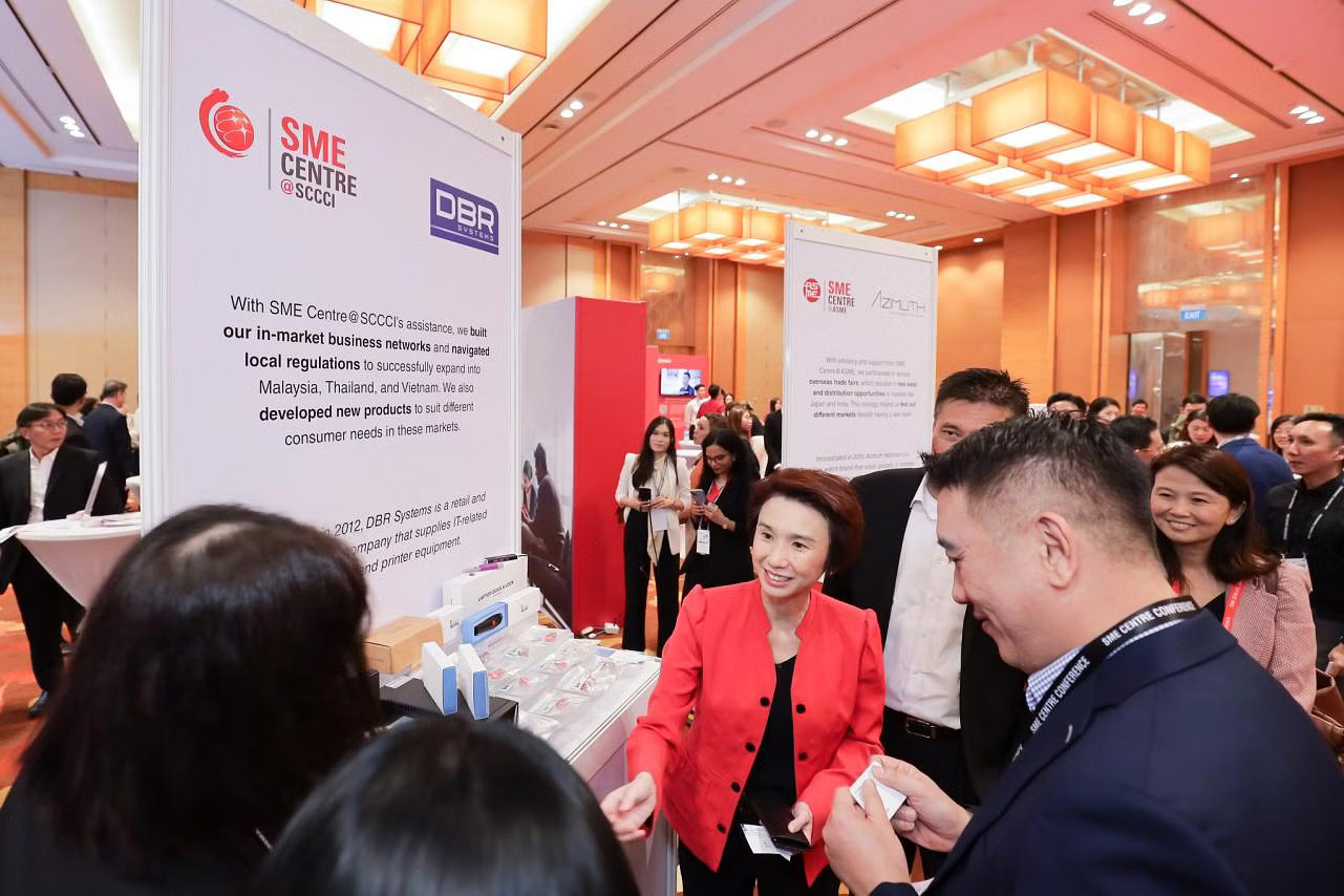 Speaking at the SME Centre Conference on Wednesday (Sep 13), Minister of State for Trade and Industry Low Yen Ling (centre) said local companies should take wing overseas because of the smallness of Singapore's domestic market. PHOTO: ENTERPRISE SINGAPORE